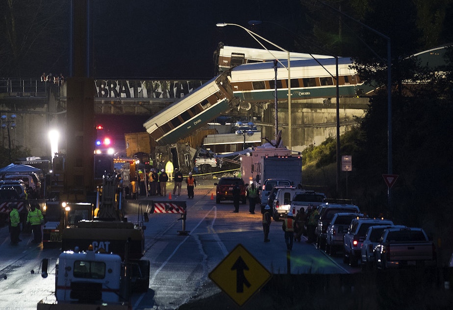 The scene of an Amtrak derailment over Interstate 5 taken in the evening on Monday, December 18, 2017 from Mounts Road.