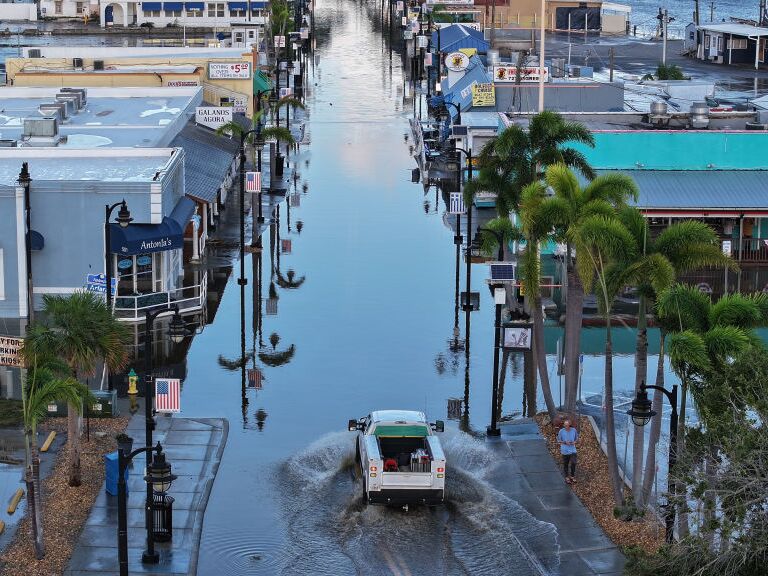 caption: Flood waters inundated the main street in Tarpon Springs, Florida after Hurricane Helene passed offshore. A new study finds that Helene was more powerful, rainier, and significantly more likely because of climate change.