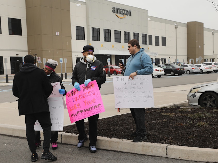 caption: Amazon workers hold a walkout over conditions at a Staten Island warehouse in March 2020.