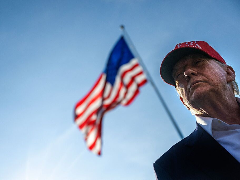 caption: President Trump talks to members of the press as he departs from the South Lawn of the White House on Tuesday.