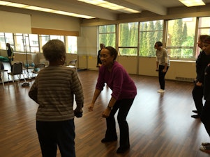 caption: Edna Daigre, center, teaches a class for older dancers in Seattle's Central Area.