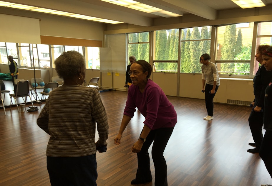 caption: Edna Daigre, center, teaches a class for older dancers in Seattle's Central Area.