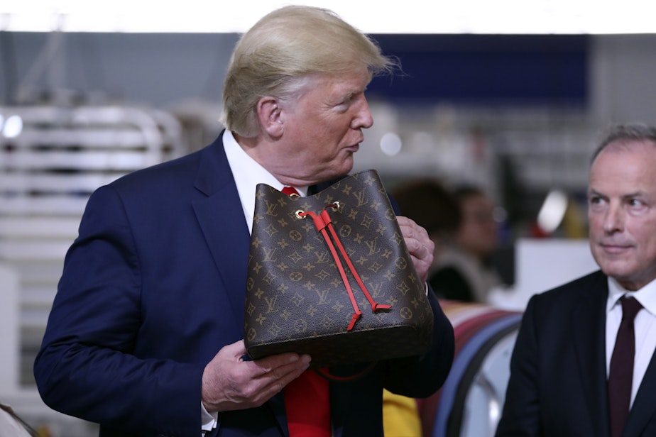 caption: President Donald Trump tours the Louis Vuitton Workshop Rochambeau in Alvarado, Texas, Thursday, Oct. 17, 2019. 