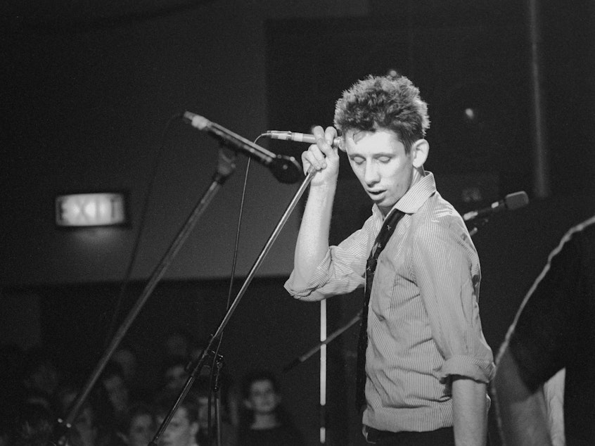 caption: Shane MacGowan live onstage in 1988, courtesy of the documentary film <em>Crock of Gold: A Few Rounds With Shane MacGowan</em>.