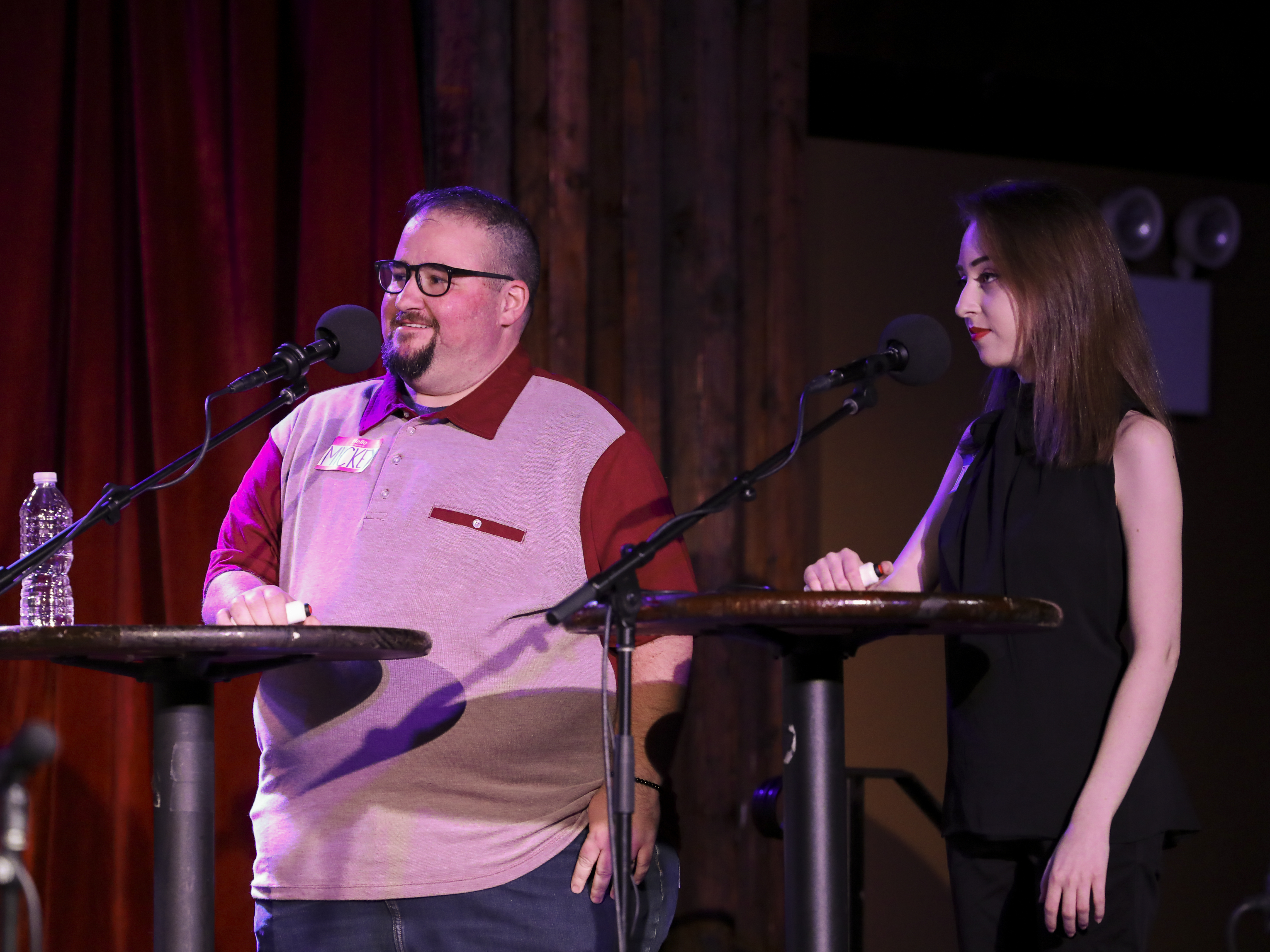 caption: Contestants Mickey Lambert and Damian Benskin appear on <em>Ask Me Another</em> at the Bell House in Brooklyn, New York.