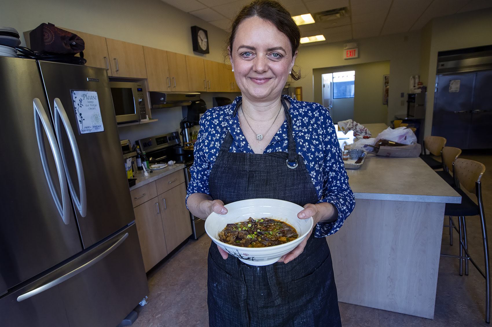 caption: Fuchsia Dunlop with her fish-fragrant eggplant. (Jesse Costa/WBUR)