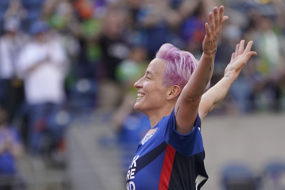 caption: OL Reign forward Megan Rapinoe (15) celebrates after she scored a goal against the Portland Thorns during the first half of an NWSL soccer match, Sunday, Aug. 29, 2021, in Seattle. 