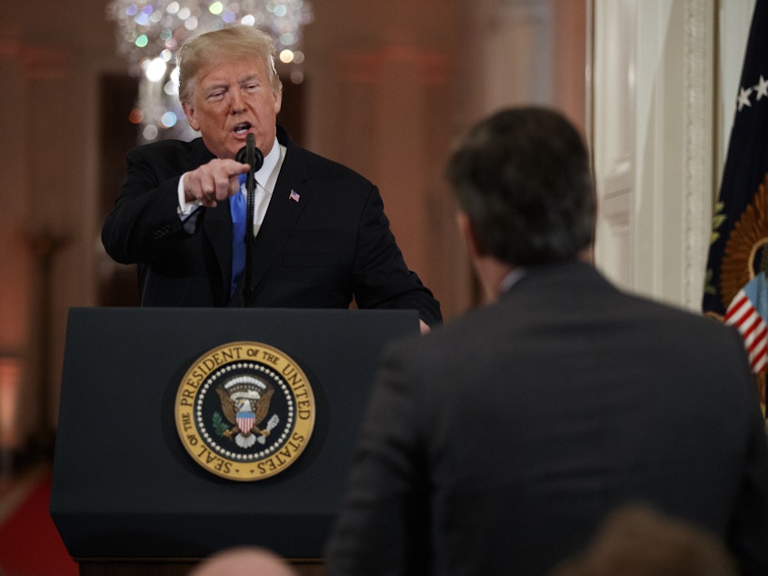 caption: President Donald Trump speaks to CNN journalist Jim Acosta during a news conference in the East Room of the White House in Washington.