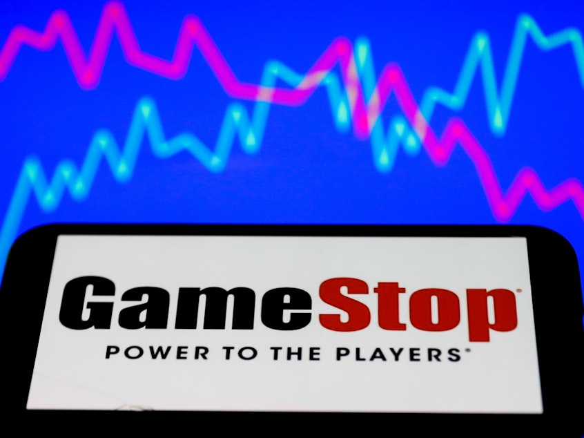 caption: Shares of GameStop have surged as amateur investors foil hedge funds' efforts to short sell the stock.