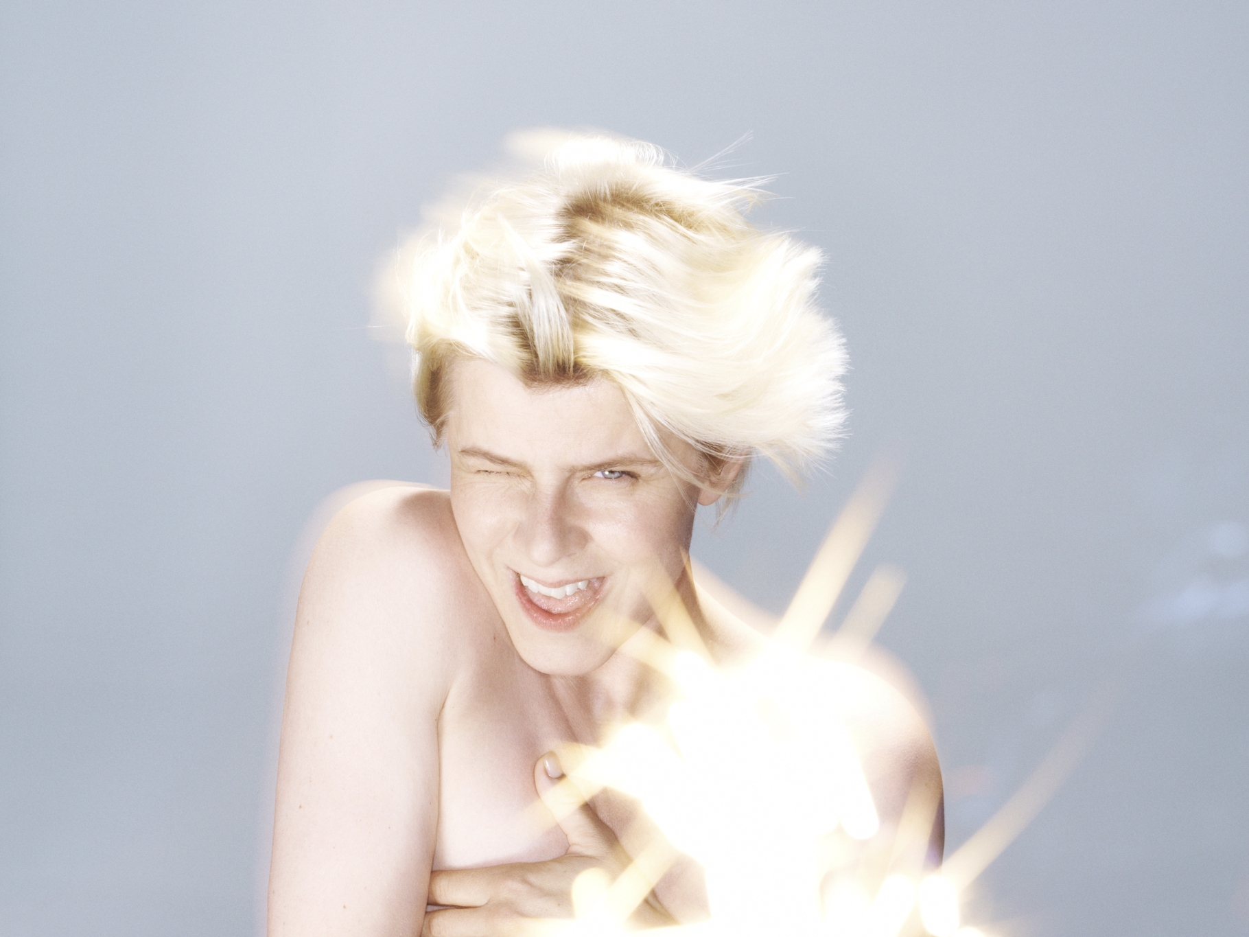 caption: "I always felt like there's this drag aspect to performing a female role," Robyn says. "It was so claustrophobic for me when I was younger but now it feels interesting to play with."