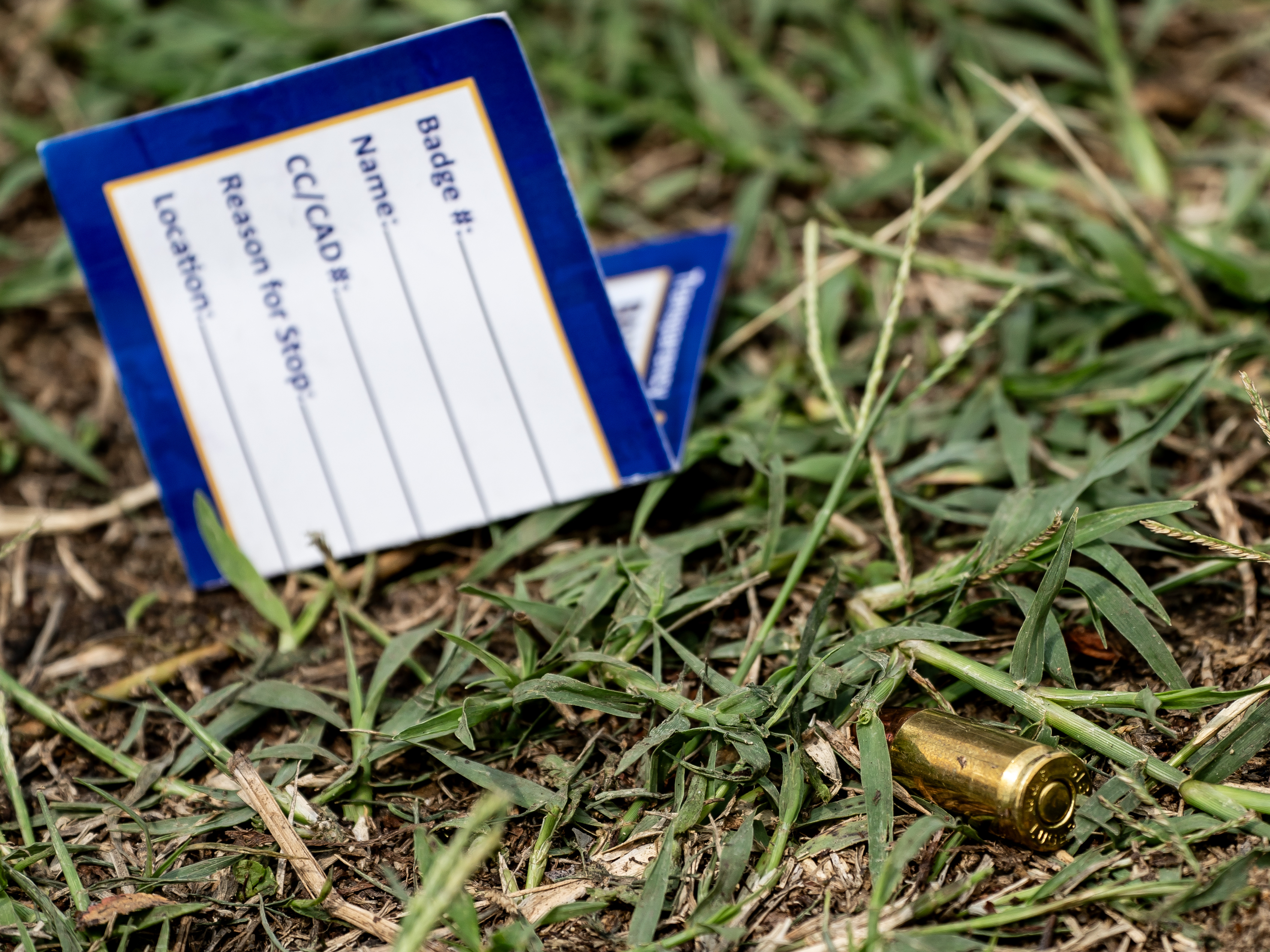 caption: A bullet casing is seen at the site of a mass shooting in the Brooklyn Homes neighborhood in Baltimore, Maryland, on Sunday. Two people were killed and 28 others were wounded during the shooting at a block party on Saturday night.