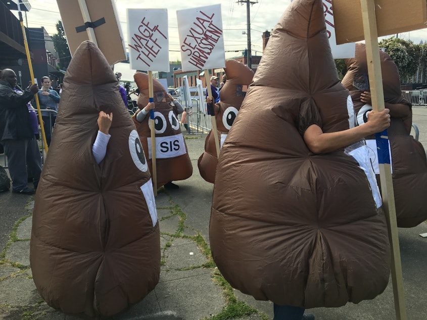 caption: These protesters at Amazon's Annual Meeting on May 22, 2019 called attention to labor practices at Amazon security contractor SIS.