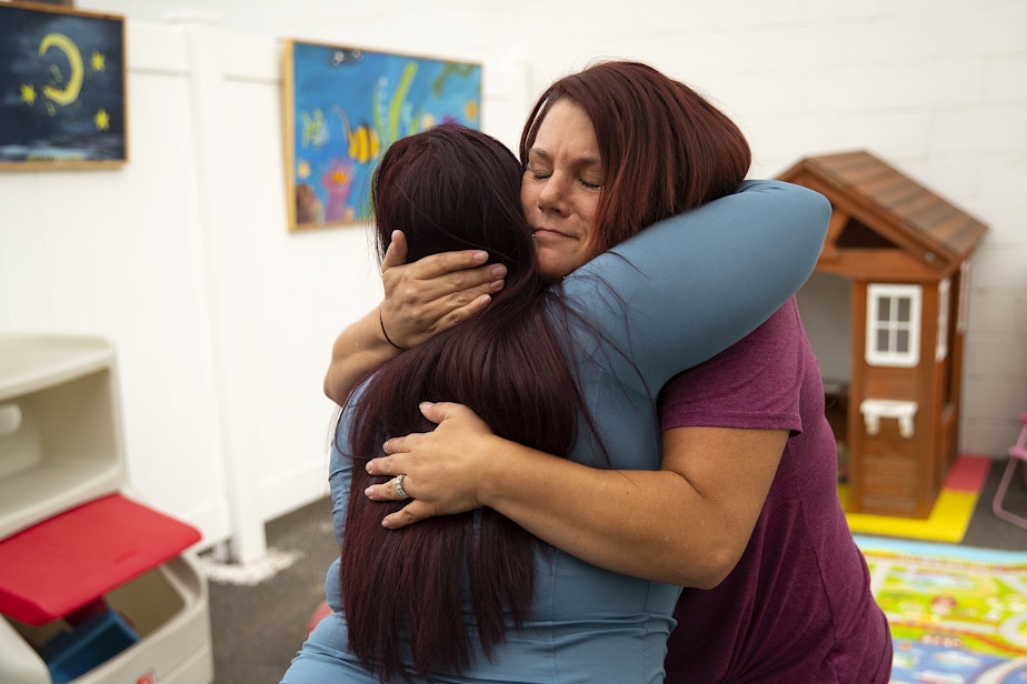 caption: Tynikki Arnold hugs Cheryl Bruno, parent ally mentor at YWCA Seattle-King-Snohomish, at the Homeward House on Friday, September 23, 2022, in Everett. 