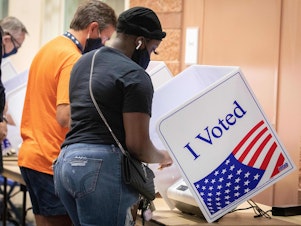 caption: Voters cast their ballots in North Charleston, S.C., on Oct. 16, 2020. A new study says the turnout gap between white and nonwhite voters in the U.S. is growing fastest<em><strong> </strong></em>in jurisdictions that were stripped of a federal voting protection by a Supreme Court decision.