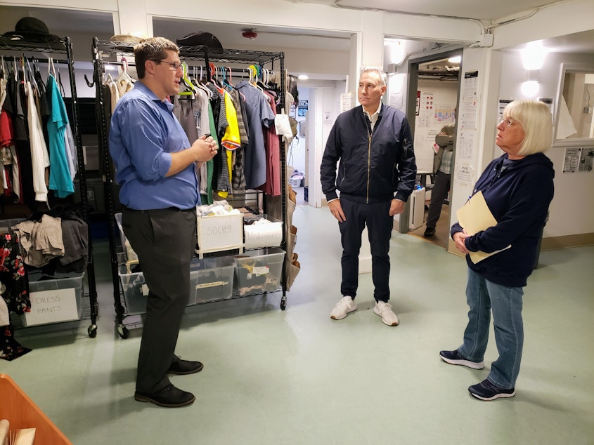 caption: Jerred Clouse of ROOTS gives a shelter tour to Sen. Patty Murray and King County Executive Dow Constantine on Tuesday, August 8, 2023. 