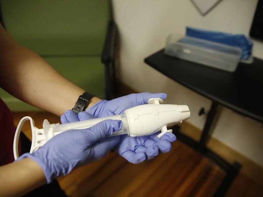 caption: For the patients having procedural abortions Dr. Arnold uses what’s called a “SofTouch” device — a small, hand-held tool that creates a vacuum and allows a doctor to empty the uterus through suction.