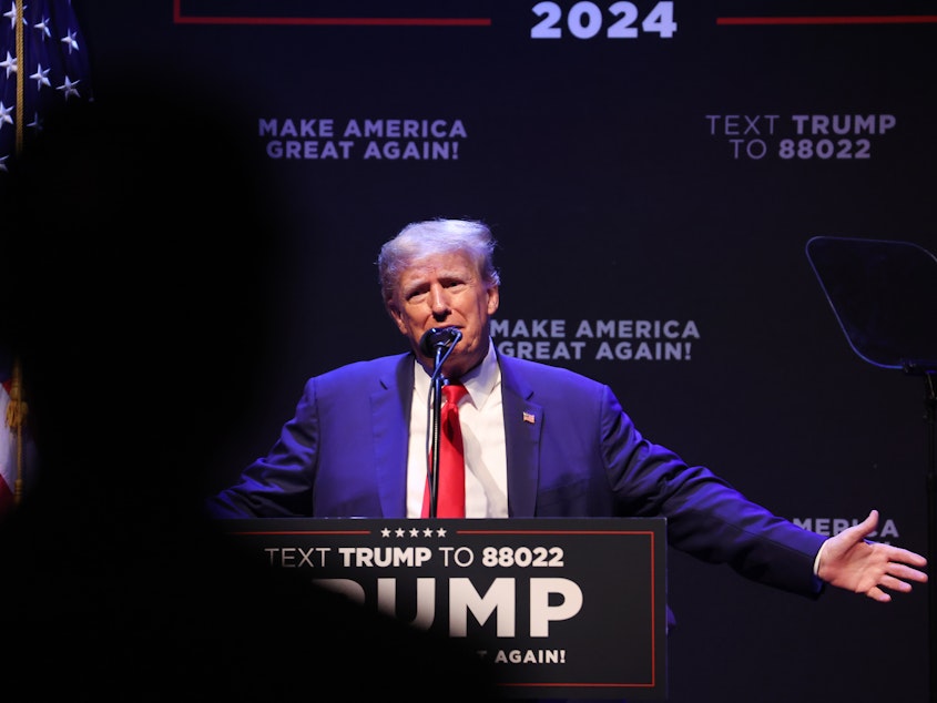 caption: Former President Donald Trump speaks at the Adler Theatre on March 13, in Davenport, Iowa. On his platform Truth Social on Saturday morning, Trump cited "illegal leaks" that he will be arrested Tuesday.