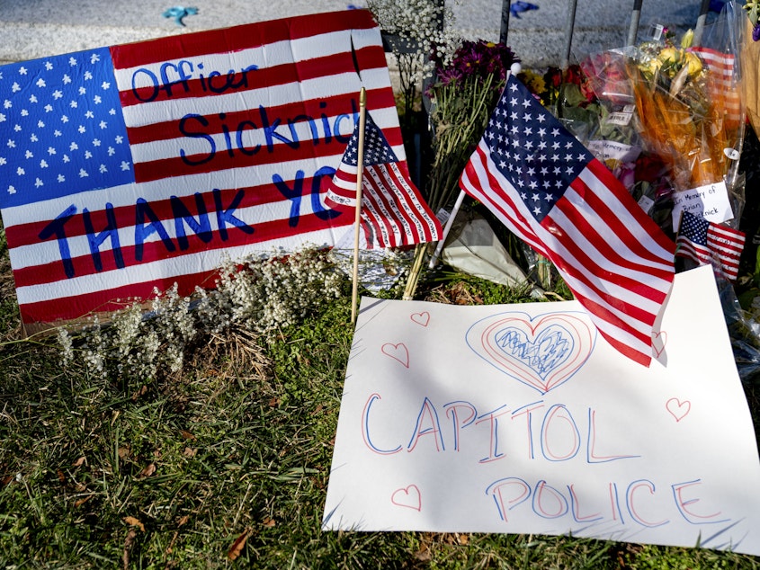 caption: A memorial for U.S. Capitol Police Officer Brian Sicknick, who was killed by rioters in the Jan. 6 attack, is set up near the U.S. Capitol.