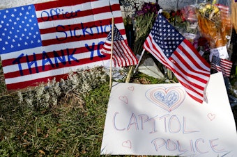 caption: A memorial for U.S. Capitol Police Officer Brian Sicknick, who was killed by rioters in the Jan. 6 attack, is set up near the U.S. Capitol.