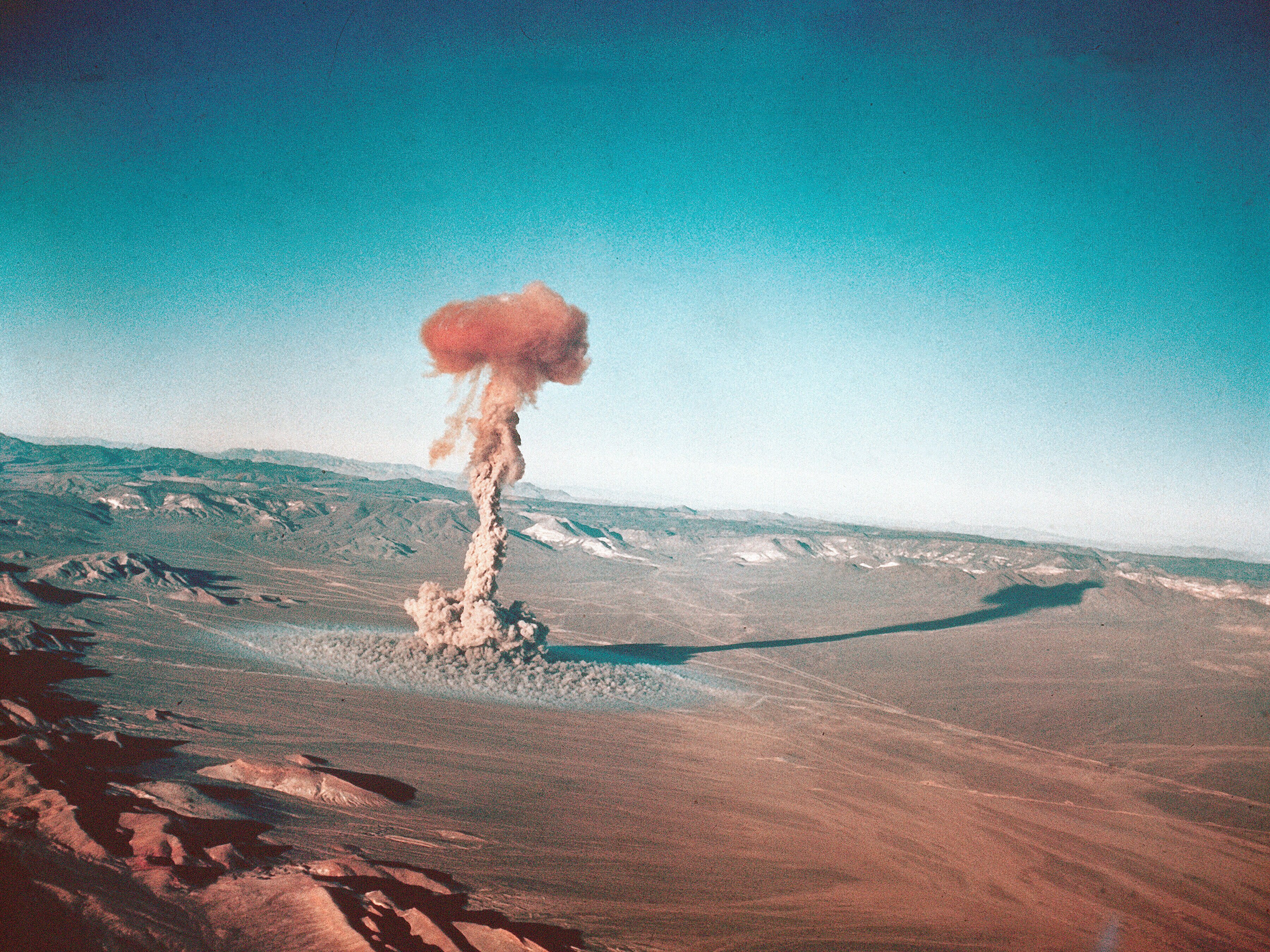 caption: A sub-surface atomic test is shown March 23, 1955 at the Nevada Test Site near Yucca Flats, Nev.