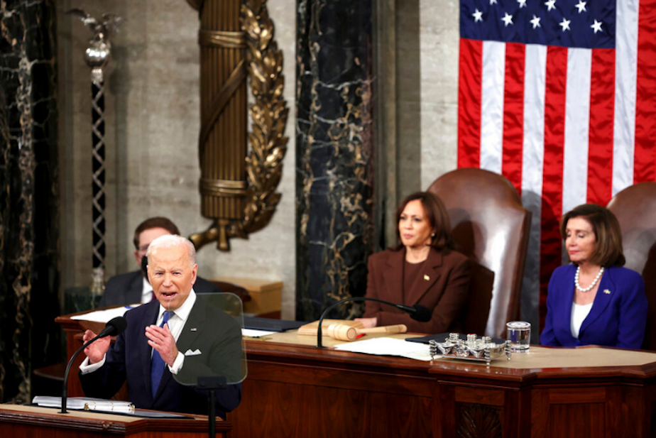 caption: President Joe Biden delivers his first State of the Union address to a joint session of Congress at the Capitol, Tuesday, March 1, 2022, in Washington as Vice President Kamala Harris and House speaker Nancy Pelosi of Calif., look on.
