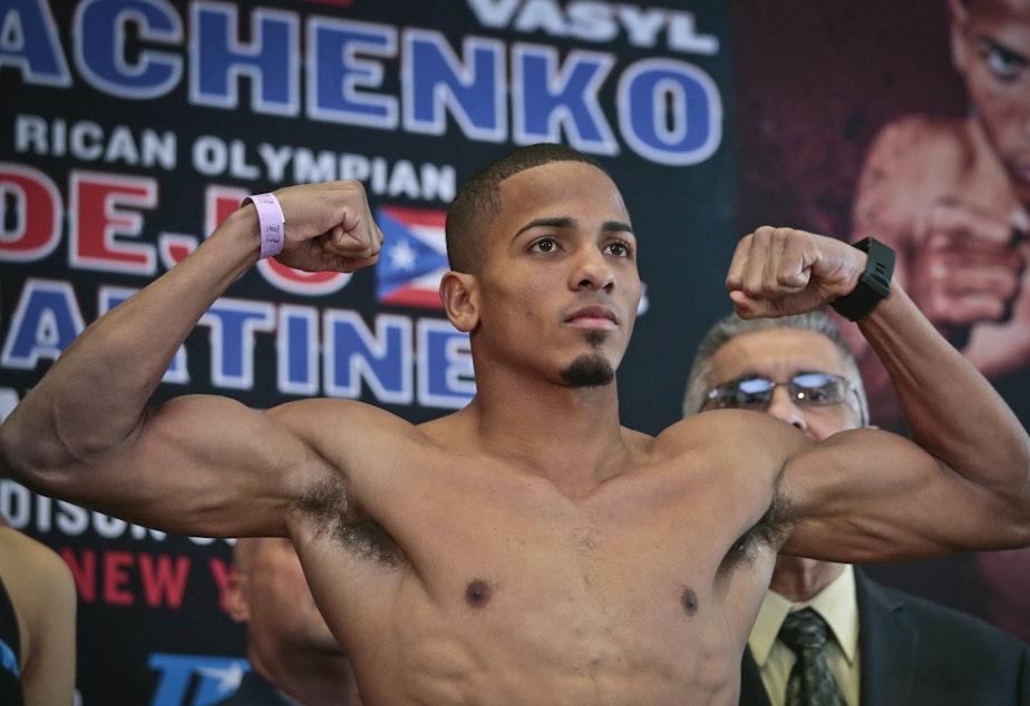 caption: Puerto Rican boxer Felix Verdejo, seen posing before a fight in 2016, allegedly punched his 27-year-old lover in the face, drugged her, then restrained her arms and legs before shooting her and dumping her into a river.