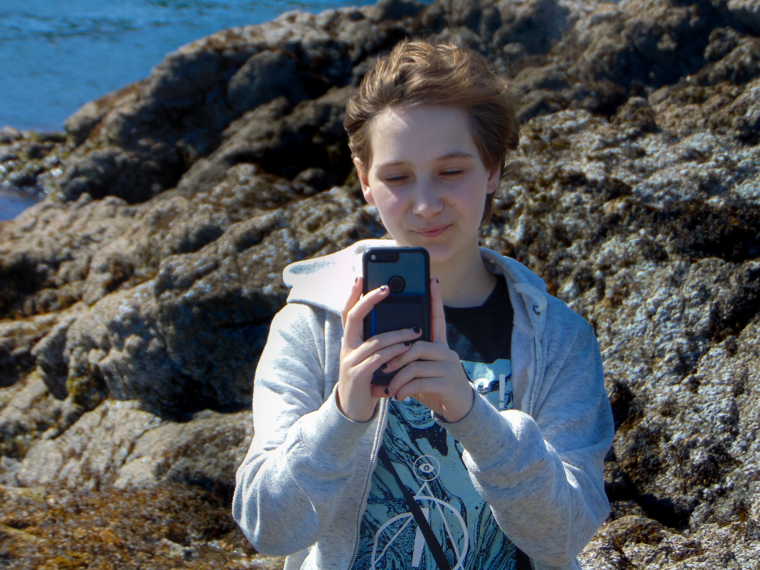 caption: Zedd Potestà takes a photo of while Caden takes a photo of him. From Caden: "This picture represents what I wrote [about love] because it's a picture of the person I wrote it about." 