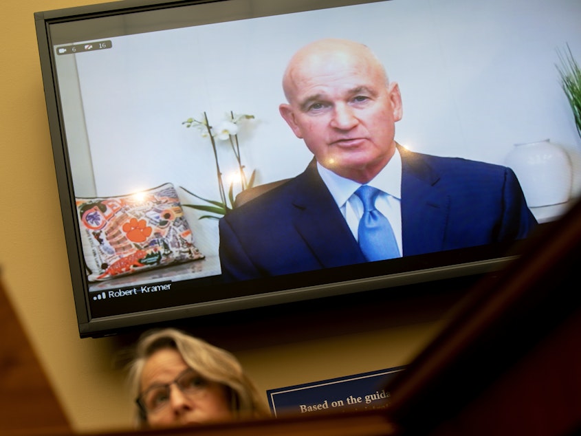 caption: Rep. Mariannette Miller-Meeks, R-Iowa, listens as Robert Kramer, president and chief executive officer of Emergent BioSolutions, testifies during a Wednesday hearing of the House Select Subcommittee on the Coronavirus Crisis.