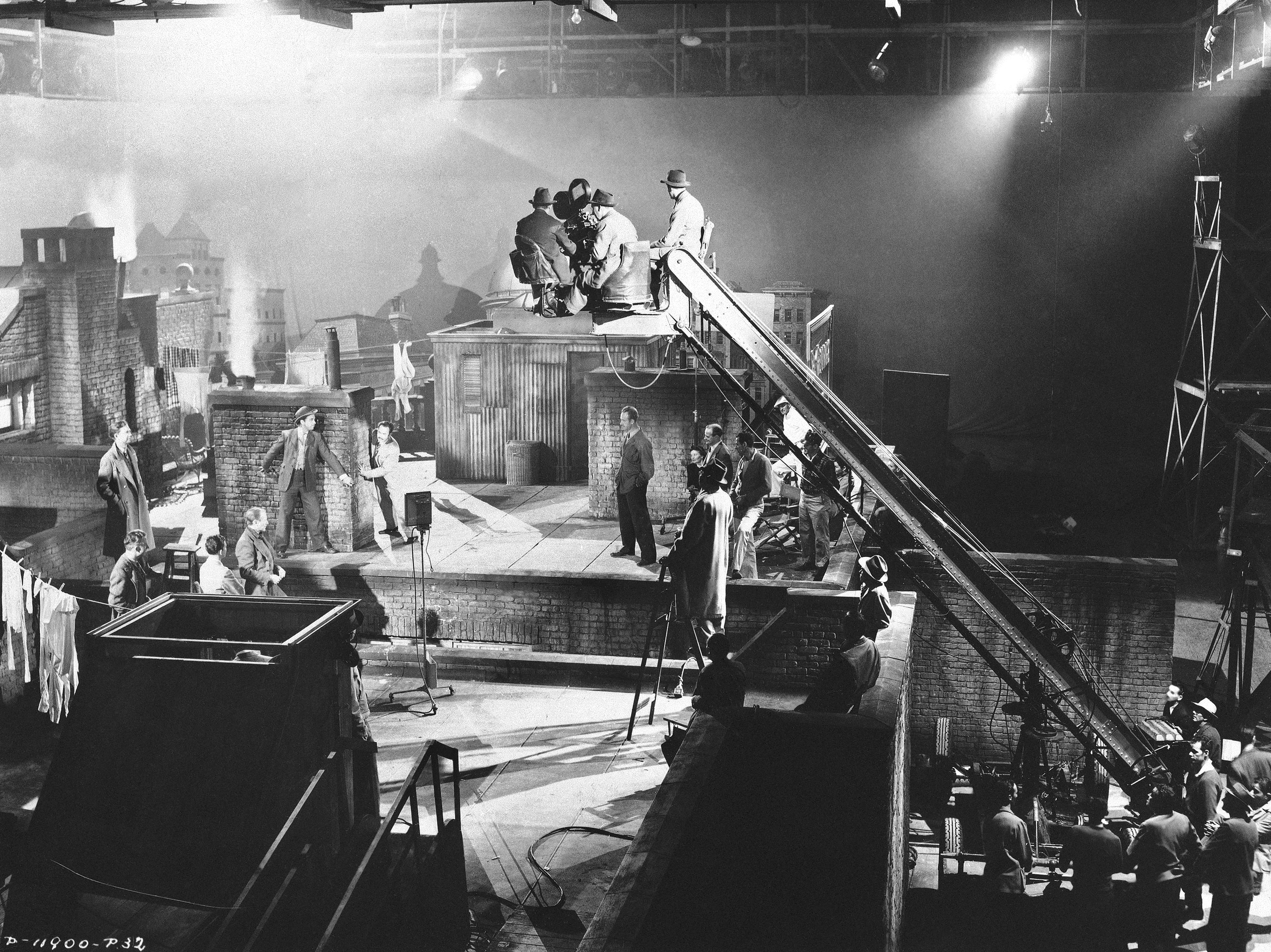 caption: Actors and other crew are shown here on the set of the movie <em>It Happened Tomorrow </em>in 1944.