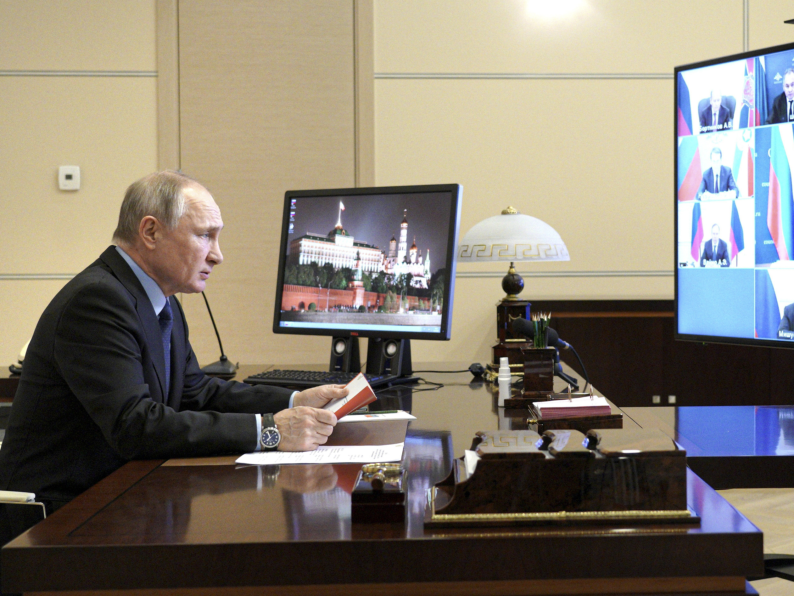 caption: Russian President Vladimir Putin authorized a campaign to help former President Donald Trump and undermine President Biden in last year's election, according to U.S. intelligence. Putin is shown here on March 12 at a residence outside Moscow.