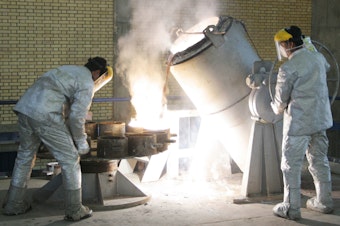 caption: Technicians work inside of a uranium conversion facility producing unit in 2005 outside the city of Isfahan, Iran. After the 2015 Iran nuclear deal put limits on the program, Iran's government has been increasing uranium enrichment since the United States pulled out of deal.