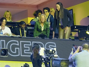 caption: First Lady Jill Biden takes a her seat before the start of the NCAA Women's Final Four championship basketball game between LSU and Iowa Sunday, April 2, 2023, in Dallas.