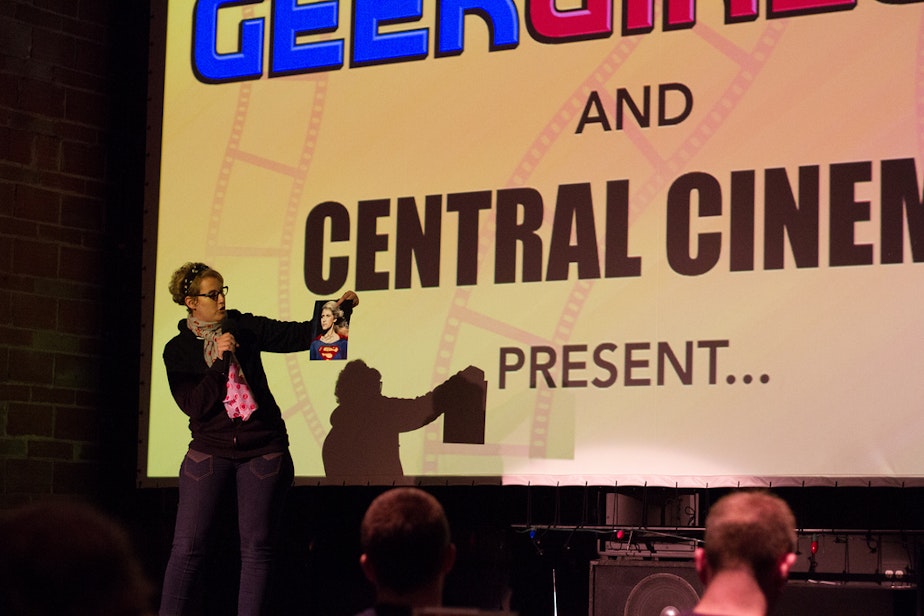 caption: GeekGirlCon programming director Jennifer K. Stuller kicks-off a viewing of "Supergirl" at a 2013 event at Central Cinema.