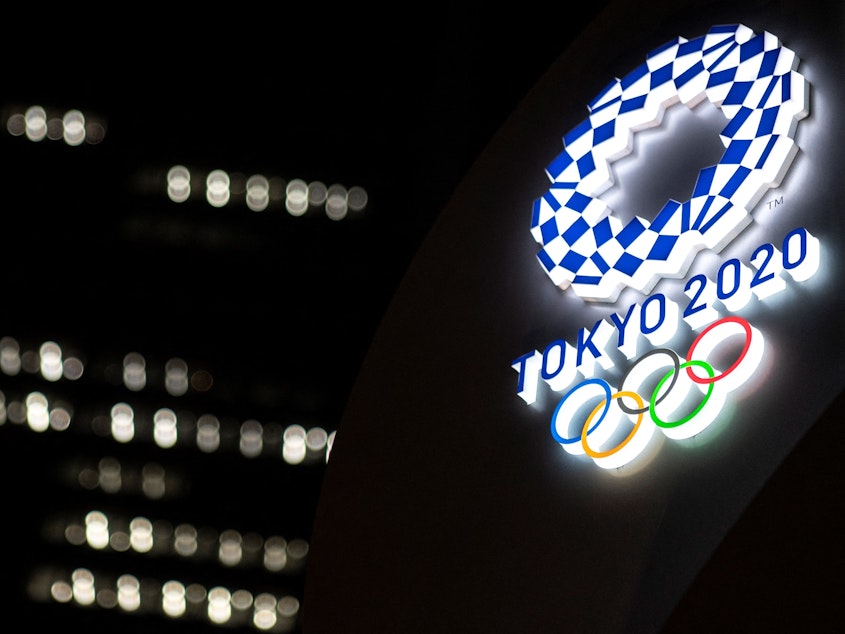 caption: The Tokyo 2020 Olympic Games logo is pictured outside the Tokyo station in Tokyo on June 22.