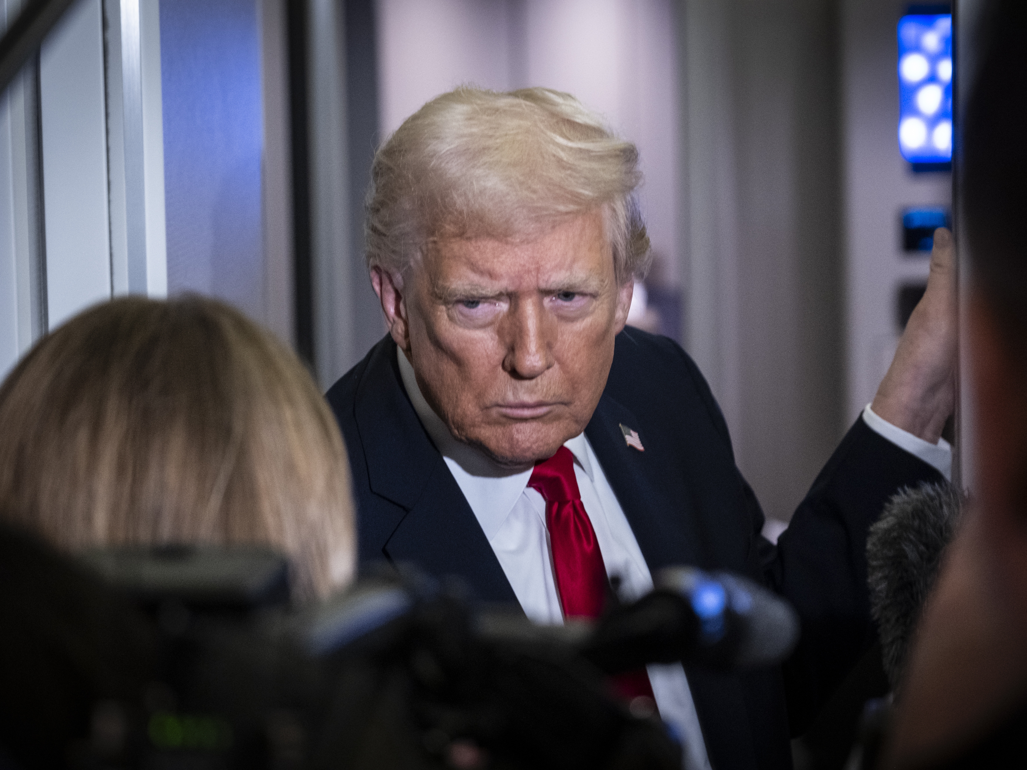 caption: President Trump speaks to the media aboard Air Force One on Tuesday.