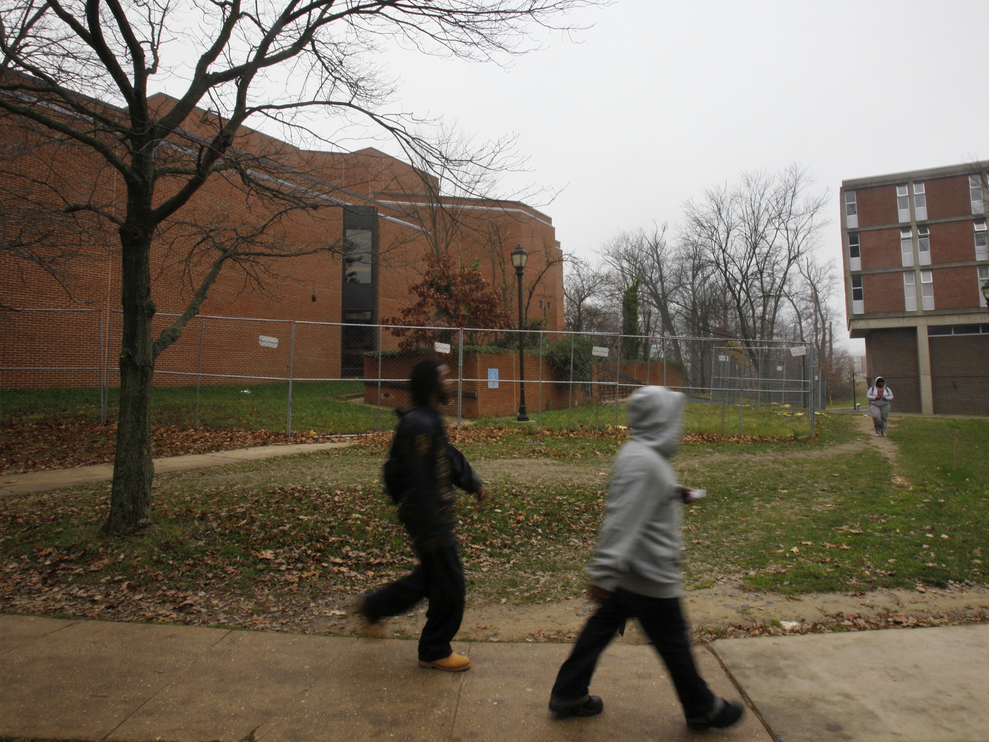 caption: FILE PHOTO  Students walk past the Langston Hughes Memorial Library, left, on the Lincoln University campus in Oxford, Pa. on Nov. 19, 2009.