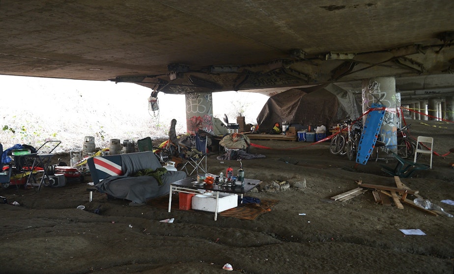 caption: The Jungle, the morning after five people were shot at the homeless encampment in January.