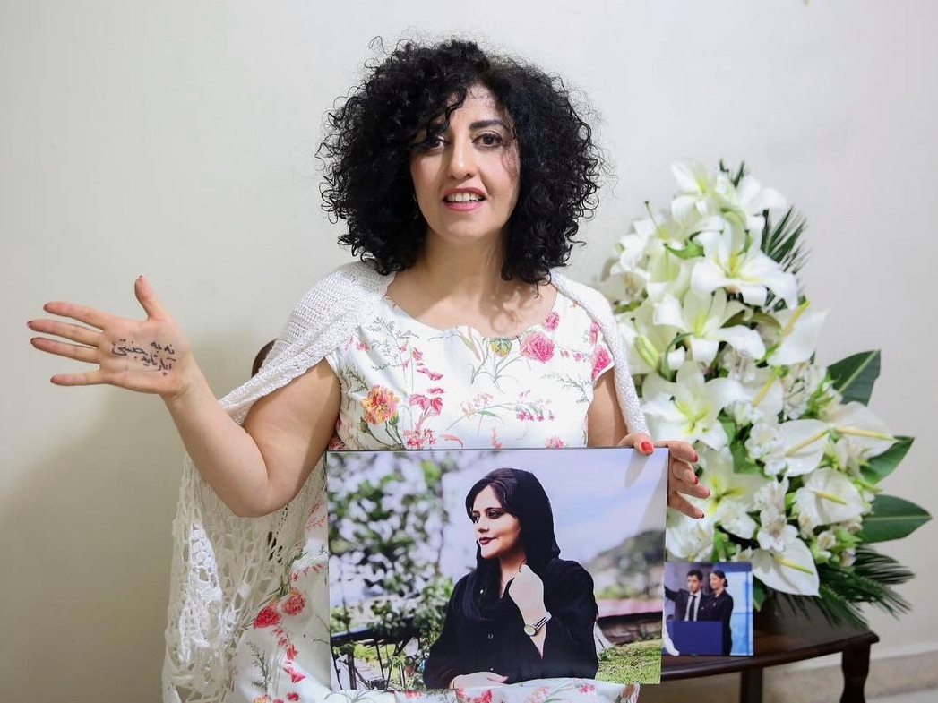 caption: FILE - In this photo released by the Narges Foundation Archive, Nobel Peace Prize laureate Narges Mohammad is seen after being released on a medical furlough in Tehran, Iran, Wednesday, Dec. 4, 2024. On her hand written in Farsi is "End gender apartheid."