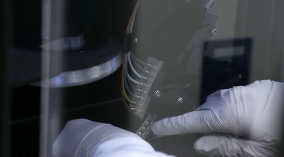 caption: Instead of printing with ink, Oregon Health and Science University scientists have figured out how to print individual cells. In this cartridge being loaded into the printer are about one million prostate cancer cells.