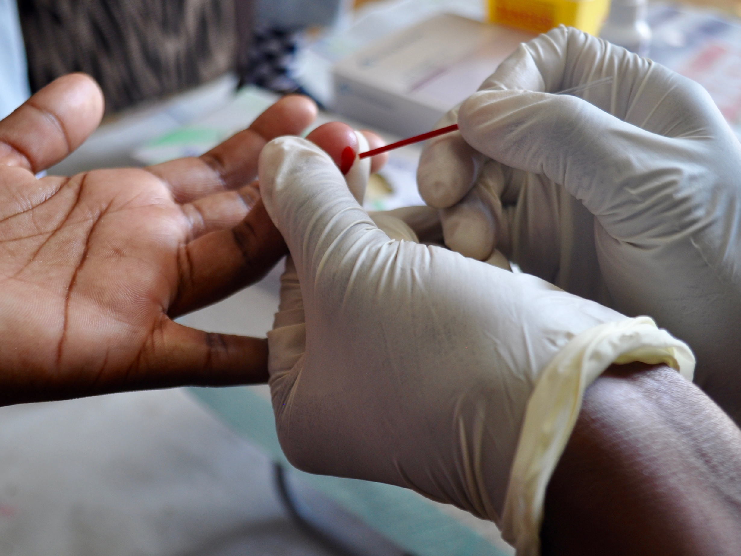 Drawing blood to test for HIV.