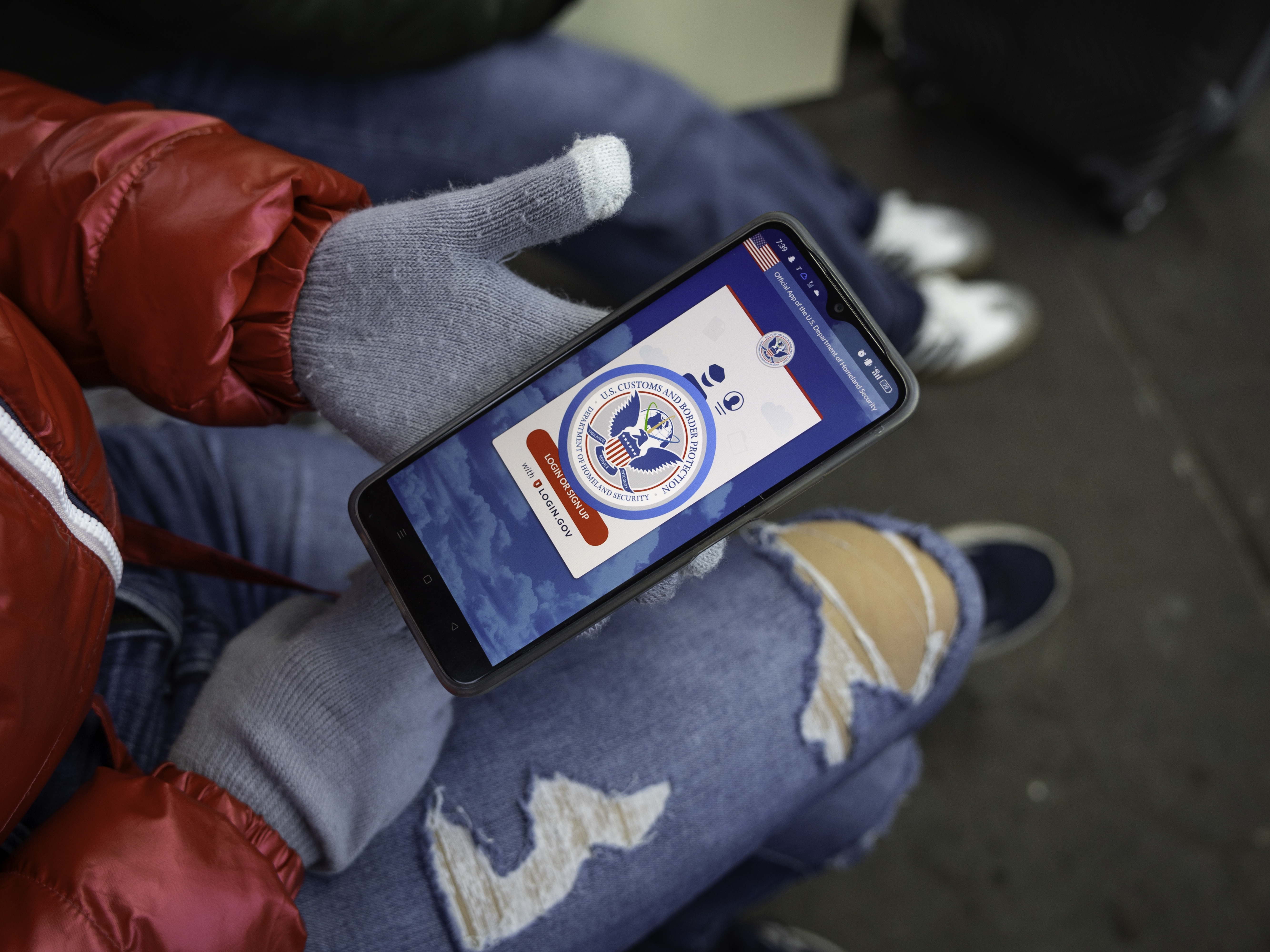 caption: An immigrant from Venezuela tries in vain to access the CBP One app a day after the second inauguration of President Trump on Jan. 21, 2025, in Nogales, Mexico. The incoming administration shut down the app, which was created by the Biden administration to allow migrants to schedule appointments to gain entry into the United States.