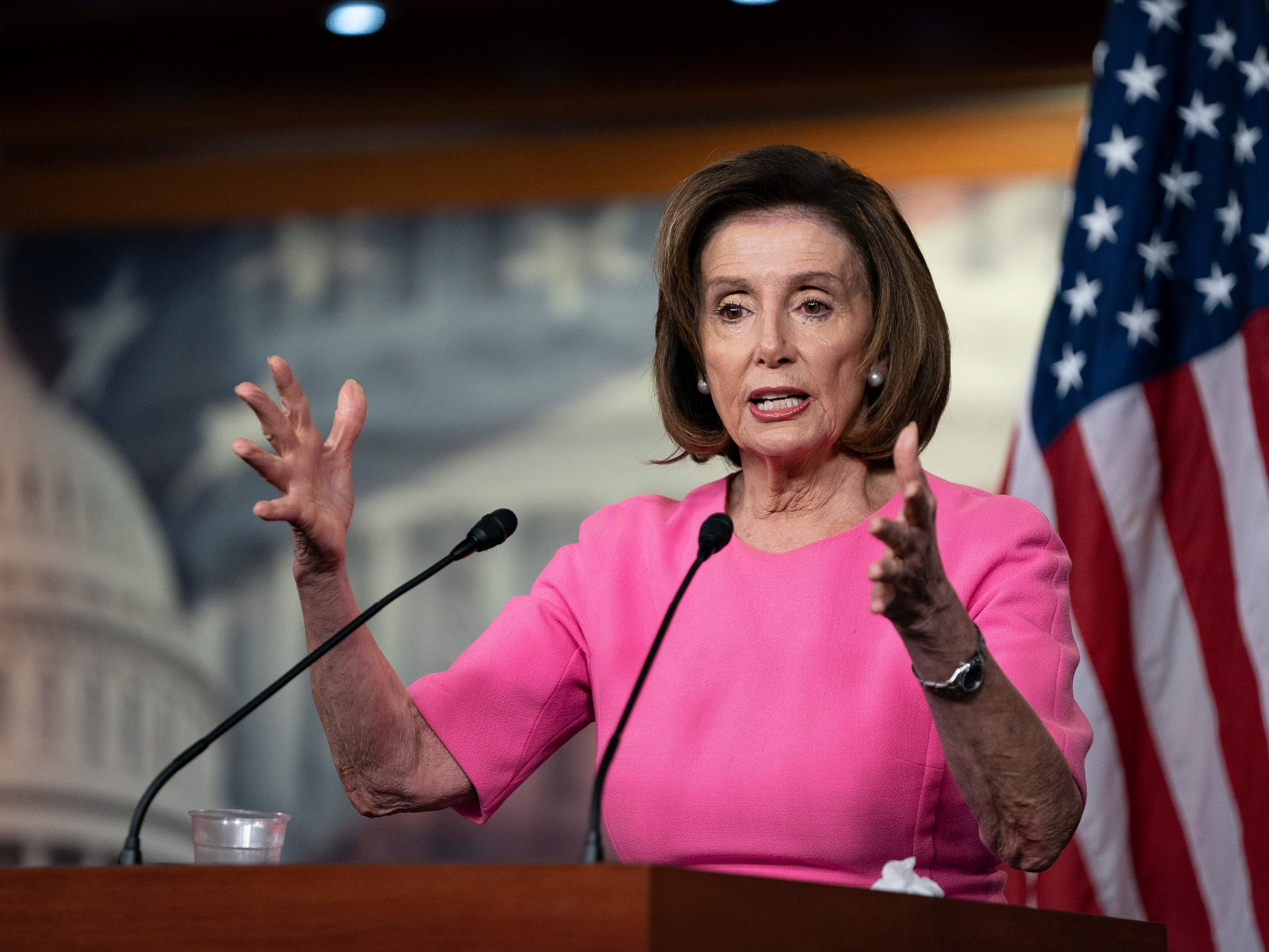 caption: House Speaker Nancy Pelosi speaks with reporters during her weekly press conference at the Capitol on Wednesday.