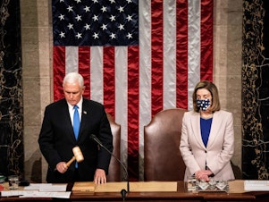 caption: Then-Vice President Mike Pence and House Speaker Nancy Pelosi preside over a joint session of Congress on Jan. 6 to certify the 2020 Electoral College results after a pro-Trump mob stormed the Capitol earlier that day.