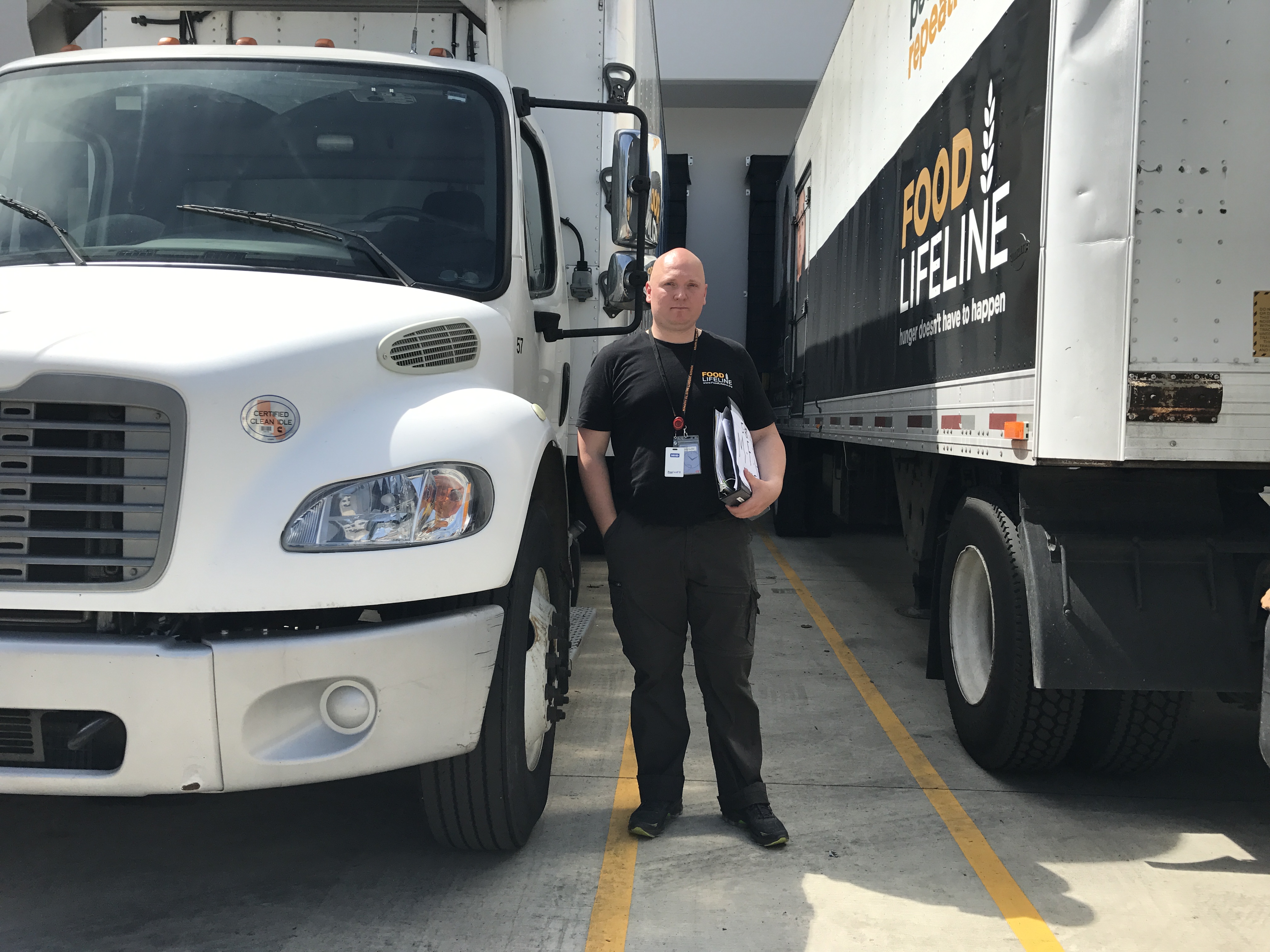 caption: Ronnie Schmidt once volunteered for Food Lifeline. Then he saw a posting for a job driving a truck for the organization. 'You see a lot of seniors that need this help. So it's nice doing it.'