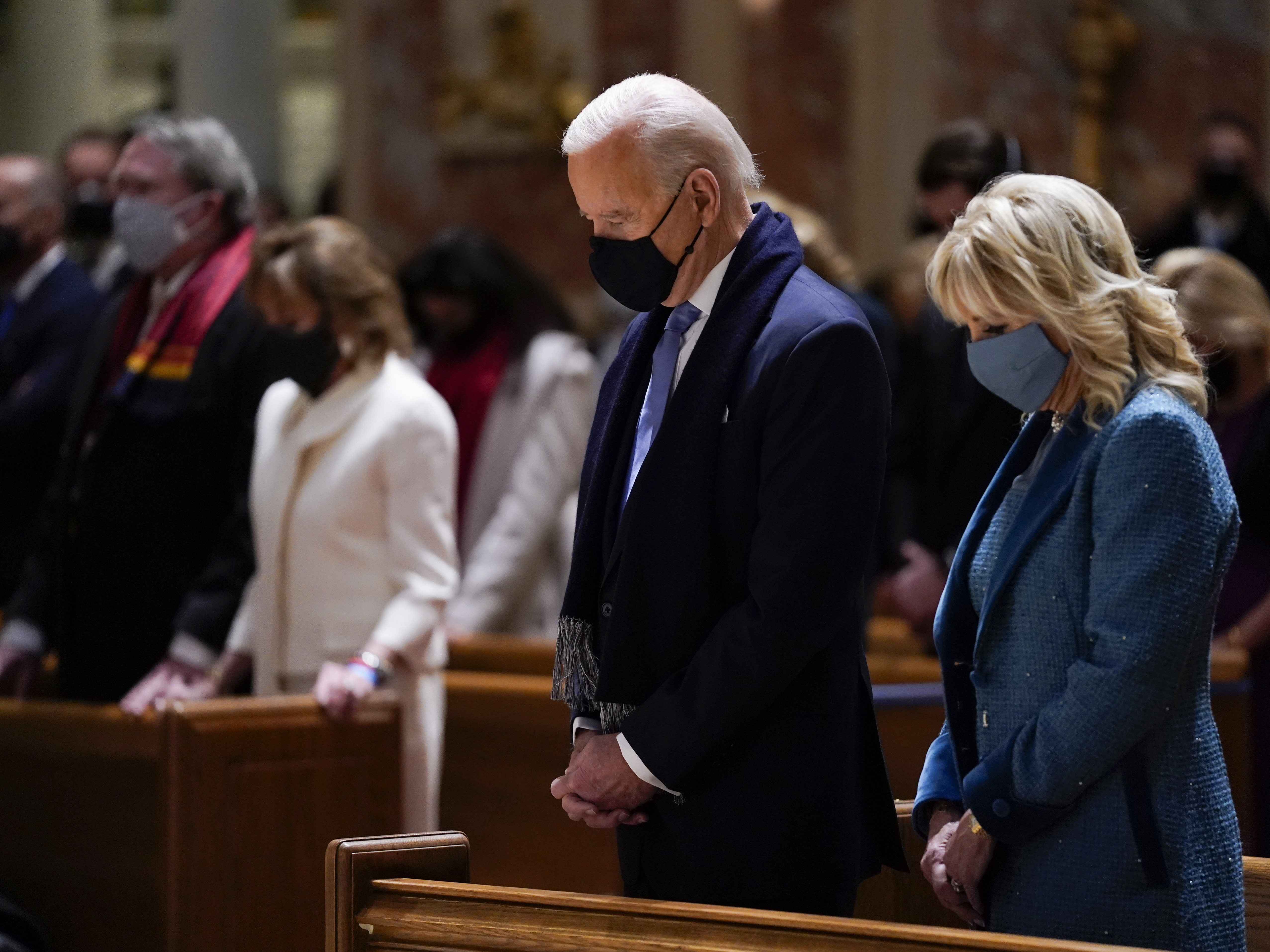 caption: President Joe Biden and his wife, Jill Biden, shown here on Jan. 20, 2021, attend Mass at the Cathedral of St. Matthew the Apostle during Inauguration Day ceremonies in Washington, D.C.