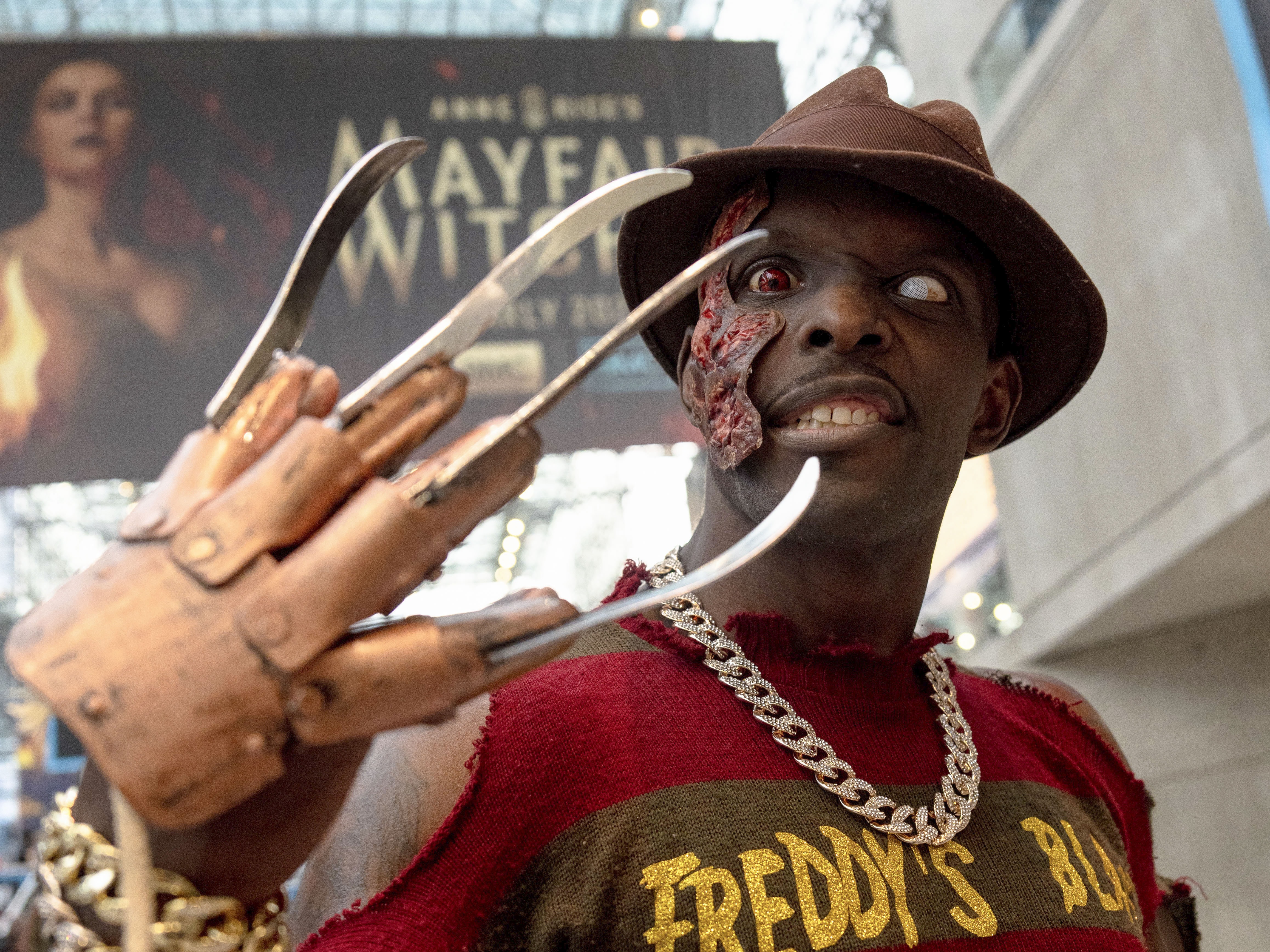 caption: "So what's my name? Watch out! I'm Black Freddie, and I'm blaaaack. Ha ha ha ha ha. Even as we get older, there's an inner child … that lies within us. They are us, you know. We're still them because the inner child lives in us," said Antwone Coward, who was dressed as Freddy Krueger at New York Comic Con in 2024.