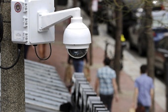 caption: Surveillance cameras, like the one here in Boston, are used throughout Massachusetts. The state now regulates how police use facial recognition technology.