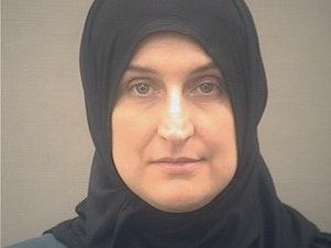caption: A photo provided by the Alexandria, Va., Sheriff's Office in January 2022 shows Allison Fluke-Ekren. Fluke-Ekren, 42, who once lived in Kansas, has been arrested after federal prosecutors charged her with joining the Islamic State group and leading an all-female battalion of AK-47 wielding militants.