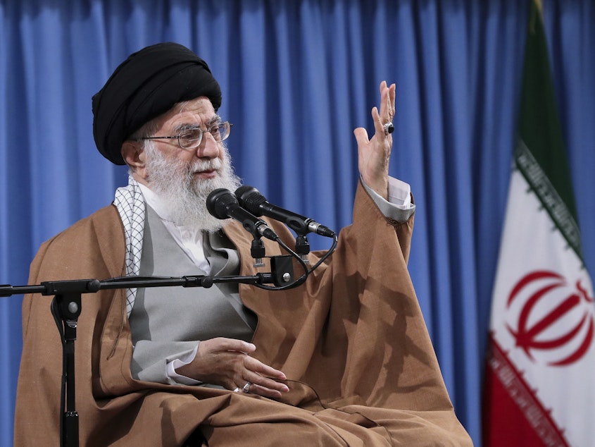 caption: Iran's supreme leader, Ayatollah Ali Khamenei, speaks with a group of Revolutionary Guards and their families in Tehran on April 9. Tensions between Iran and the U.S. have escalated recently following Iran's shootdown of a U.S. drone and U.S. cyberattacks against an Iranian intelligence group. On Monday, President Trump announced financial sanctions against Khamenei and other top officials.