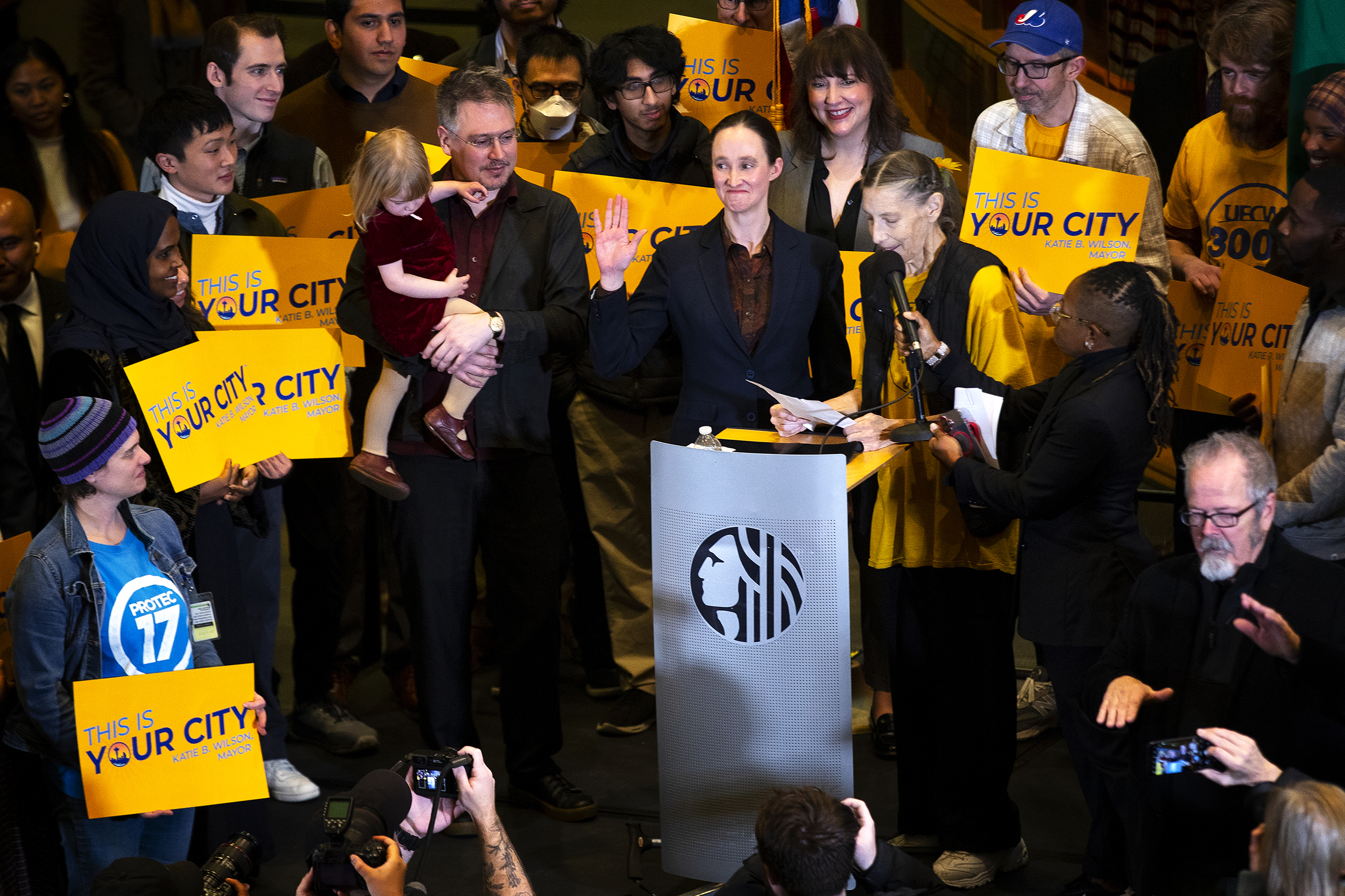 caption: Katie Wilson takes the oath of office while being sworn in as the mayor of Seattle by Pauline Van Senus, also known as the "transit fairy," on Friday, Jan. 2, 2026, at Seattle City Hall. 